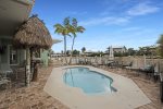 Back yard of the home with private fenced pool  tiki hut to make yourself right at home at